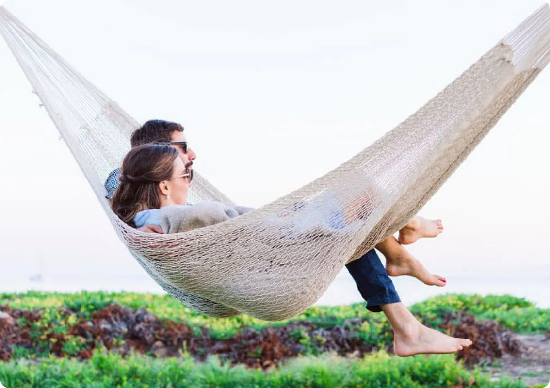 Couple relaxing on a hammock